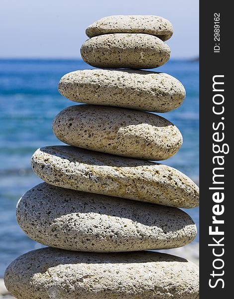 Balancing stones with the sea on the background. Balancing stones with the sea on the background
