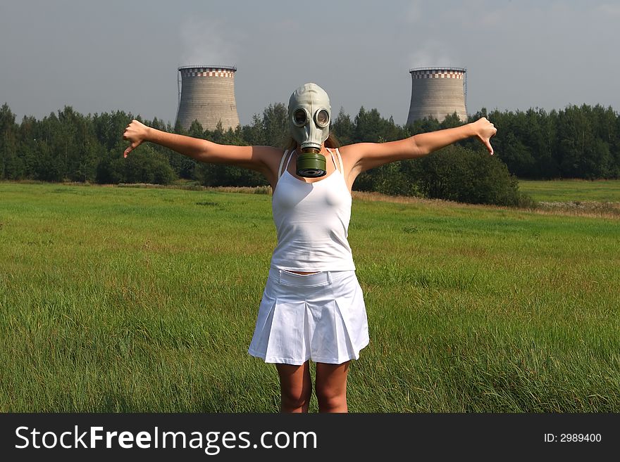 Girl in a gas mask and smoke pipes