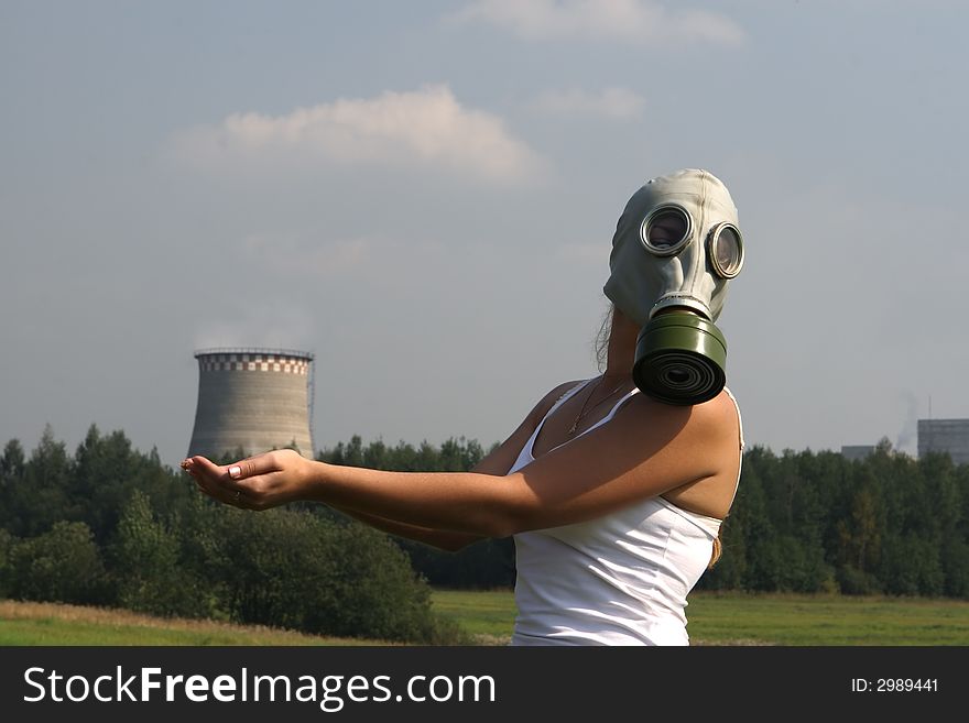 Girl in a gas mask and smoke pipe