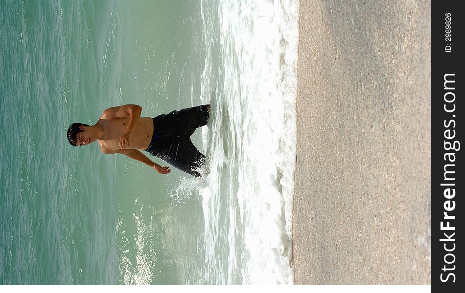 Athletic Teen Boy On Beach