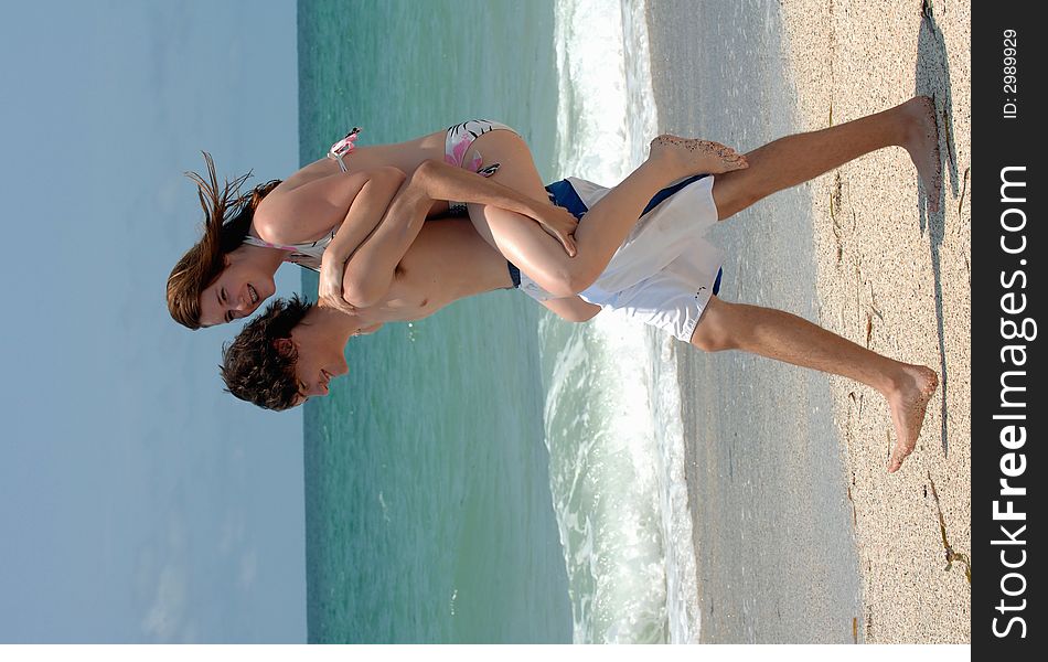 Playful Young Beach Couple