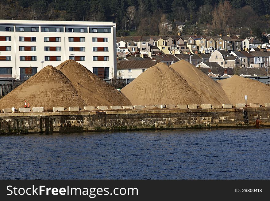 Mounds Of Sand On A Dockside