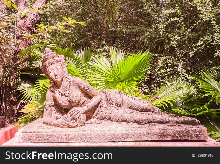 Sculpture Of Reclining Fairy In Botanic Garden