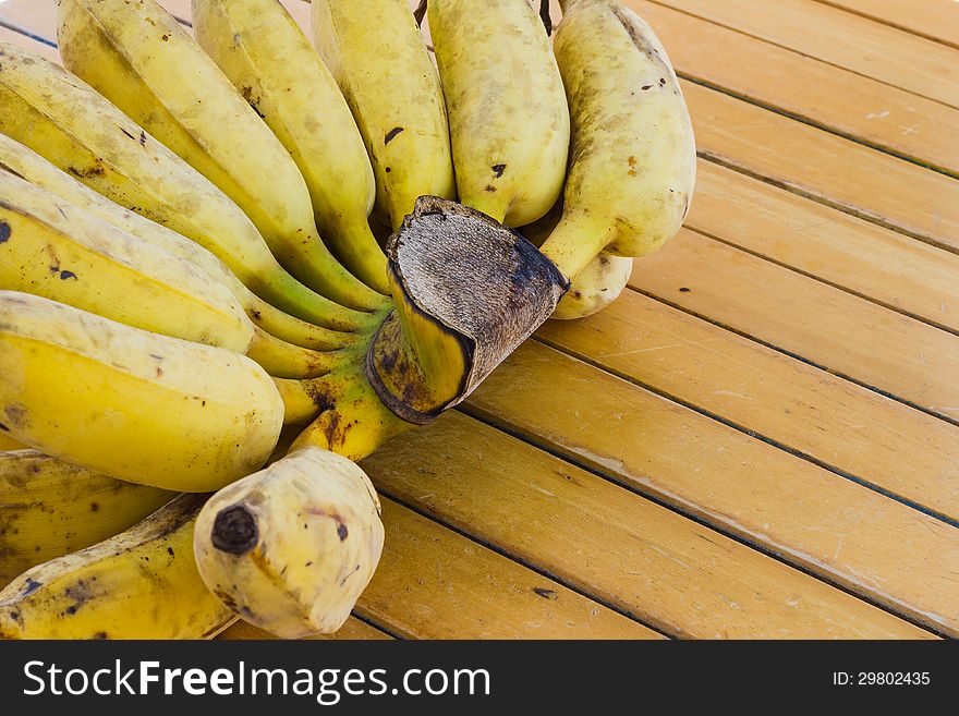 Bunch of banana on wooden table
