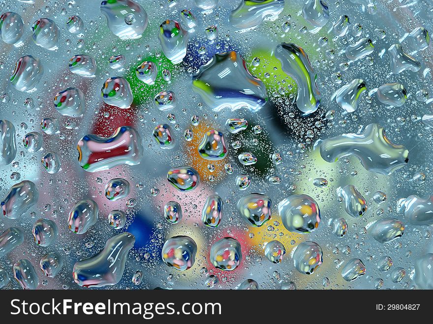 Colorful water drop on glass plate background