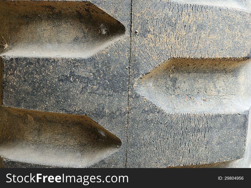 Close up on the old dirty tire foot print oftruck background