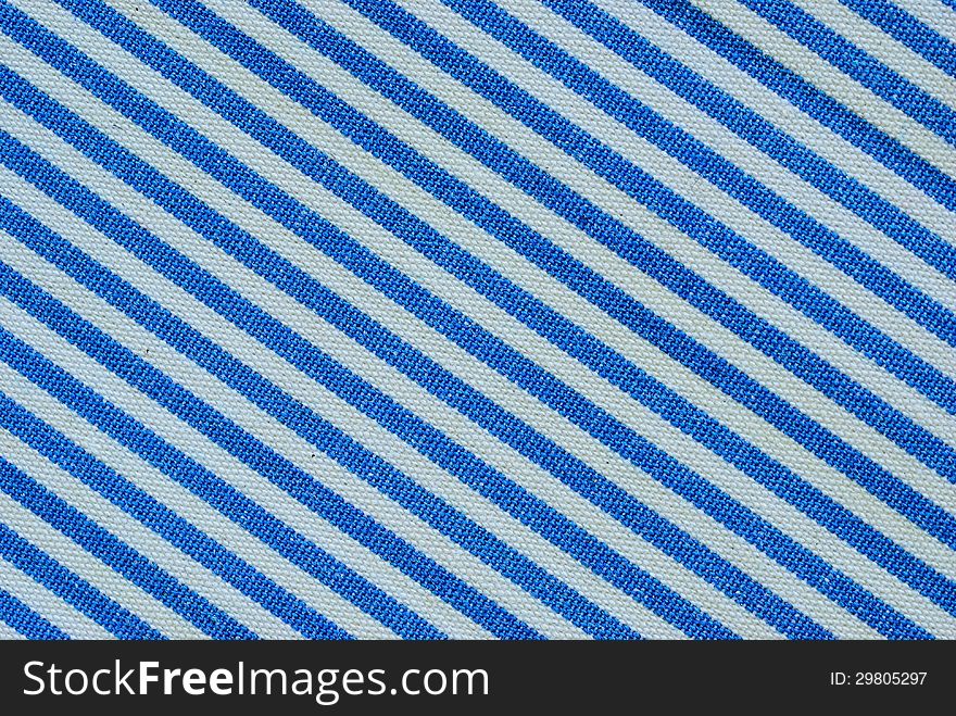 Close up on blue and white line fabric with 30 degree angle