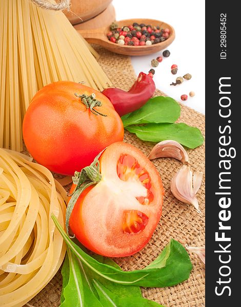 Italian pasta with spices and vegetables, food ingredients