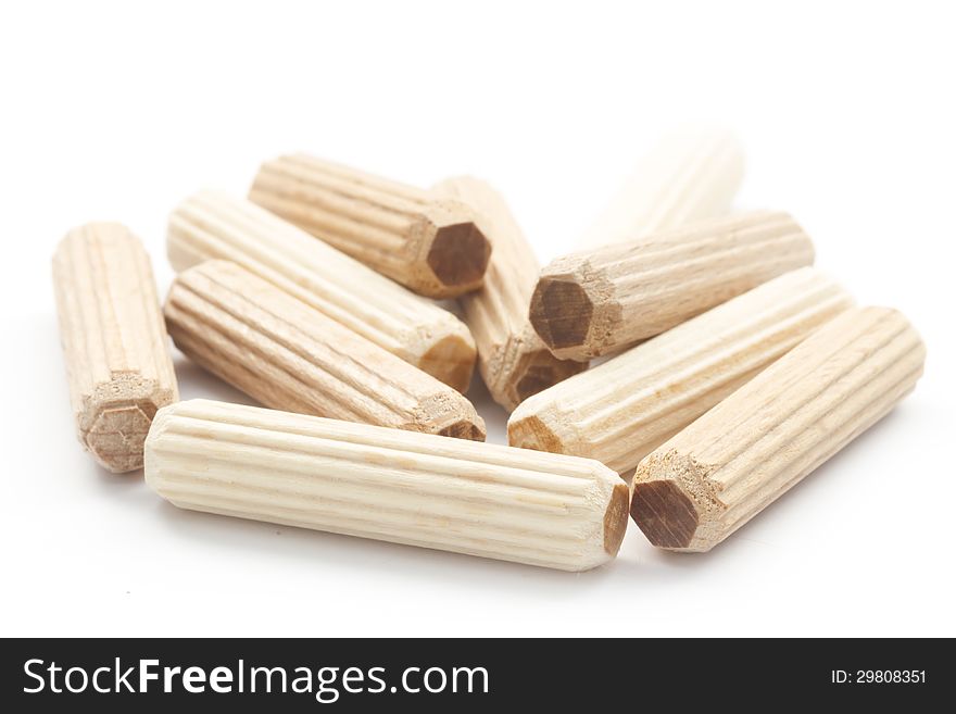 Group of wooden dowels isolated on white back