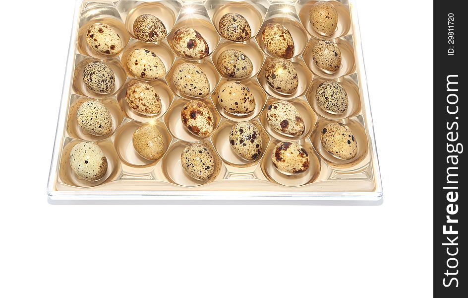 Quail eggs in package isolated on white. Quail eggs in package isolated on white