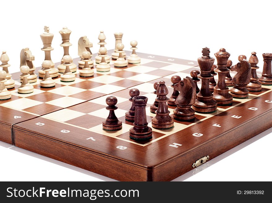 A wooden chess board isolated on white. A wooden chess board isolated on white.