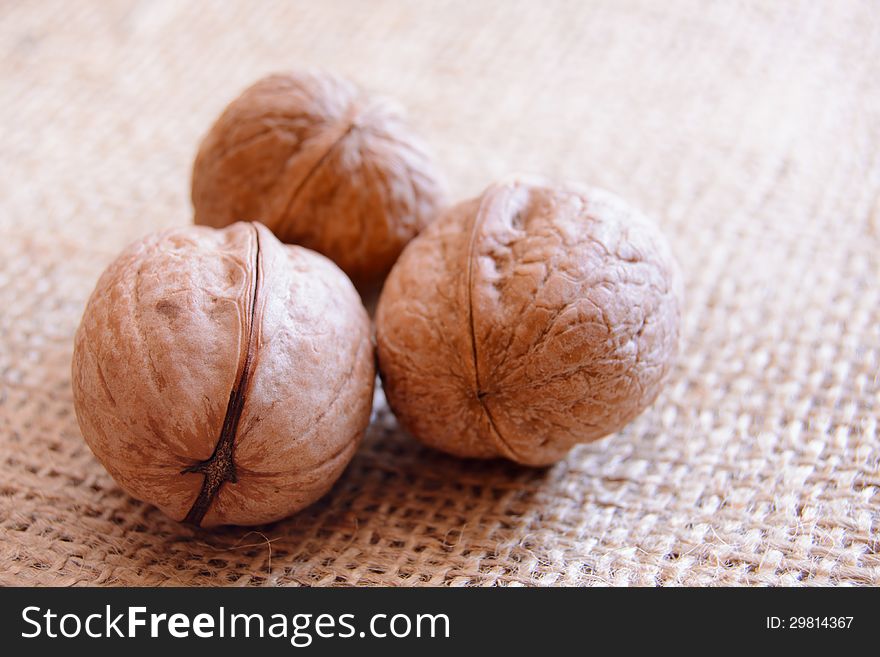 Mature walnuts on the woven fabric