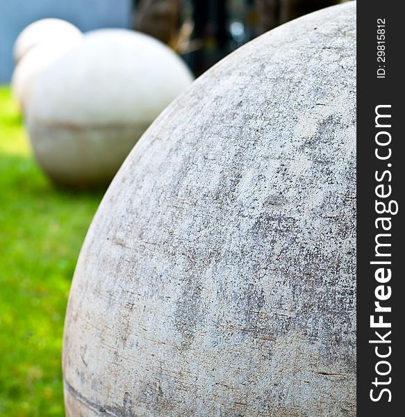 Cement sphere in zen garden.