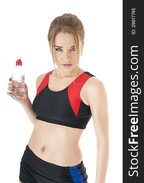 Athletic  girl keep the plastic water bottle.