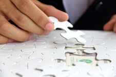 Hand Holding A Puzzle Piece, Money Concept Stock Photography Hand Holding A Puzzle Piece, Money Concept Stock Photography