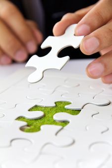 Hand Holding A Puzzle Piece, Green Space Concept Stock Images Hand Holding A Puzzle Piece, Green Space Concept Stock Images