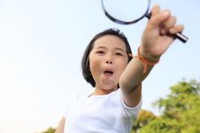 Little Girl Holding A Magnifying Glass Stock Image