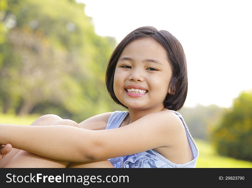 Girl Smiling Happily In The Park