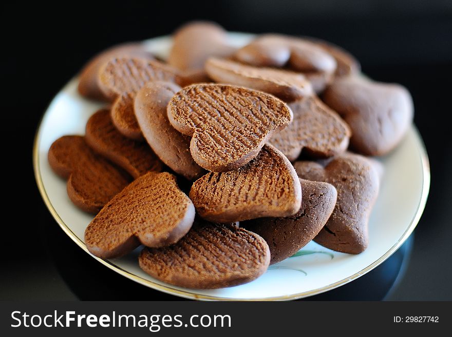 Chocolate biscuits in the shape of a heart on a plate