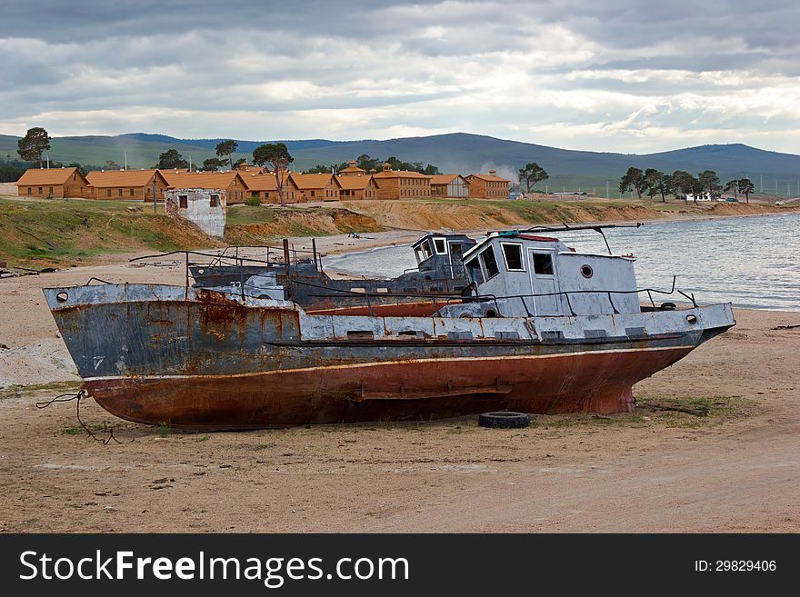 The old ships lay on lakeshore Baikal about settlement Huzhir on island Olkhon. The old ships lay on lakeshore Baikal about settlement Huzhir on island Olkhon