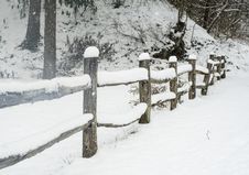 Snow Covering A Split Rail Fence. Royalty Free Stock Image