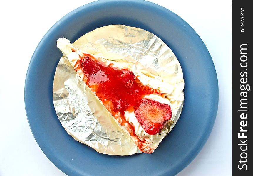 Strawberry cake on the blue dish