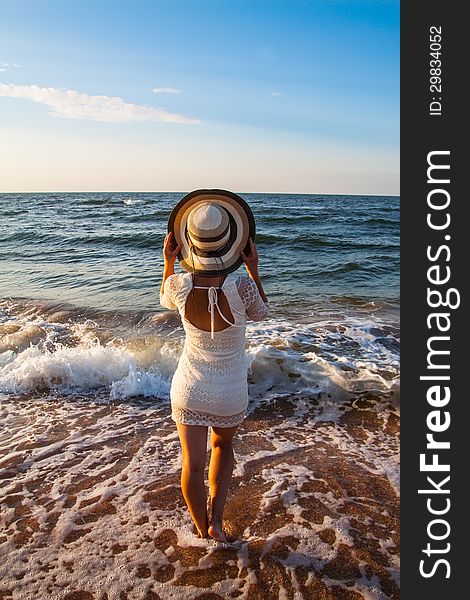 Young Woman Standing  In Sea Looking Ahead