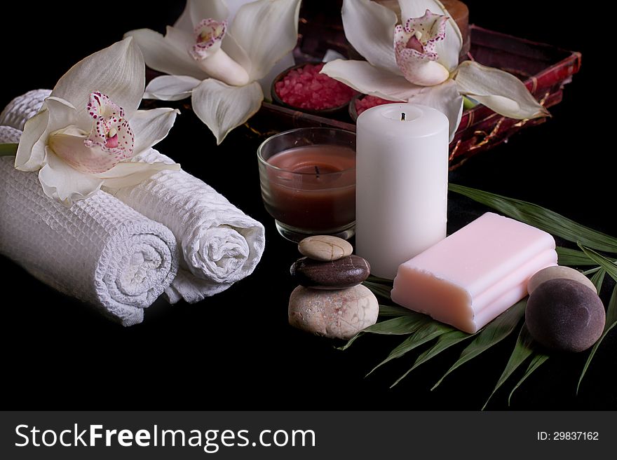 White orchids, spa products in wooden box