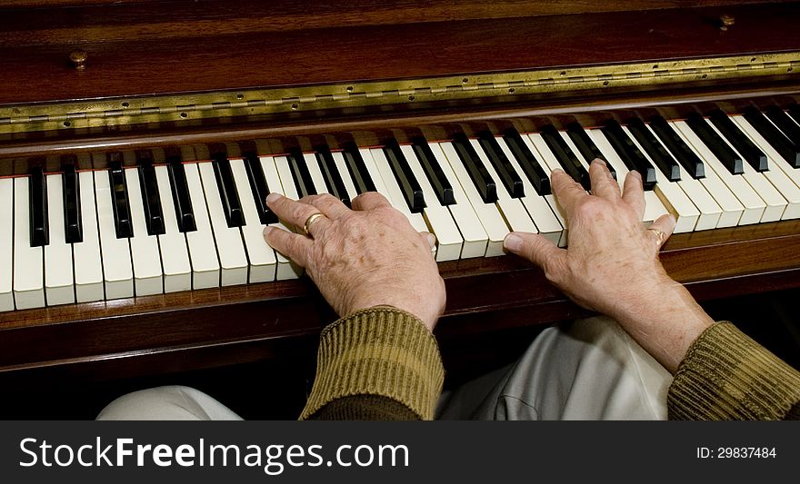 Rear flash, showing slight movement on the hands on the piano.