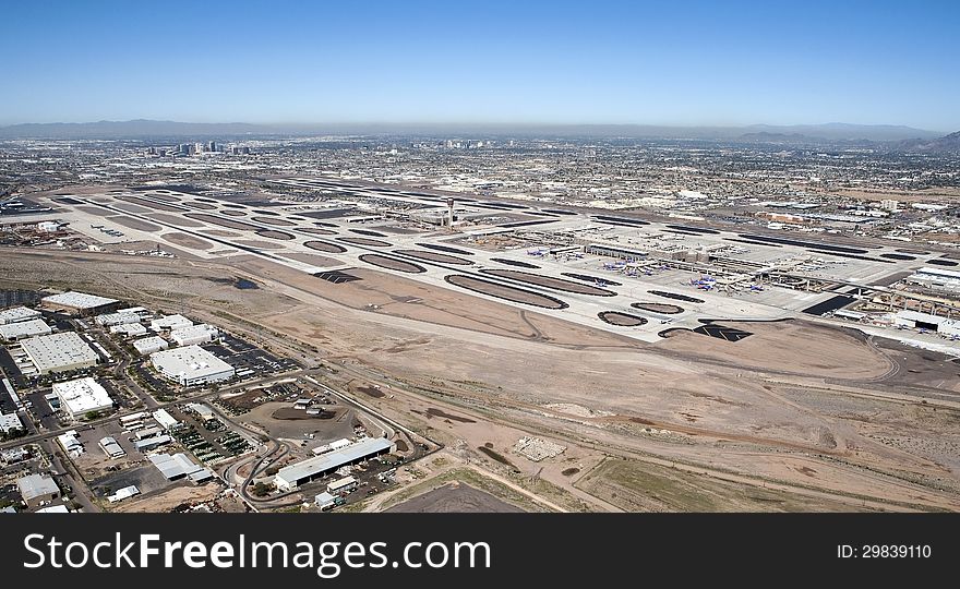 Aerial view of Sky Harbor Airport with the city of Phoenix, Arizona skyline in the distance