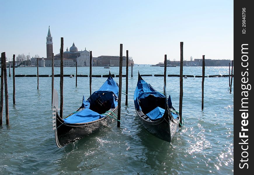 Gondolas in Venice and isle of San Giorgio Maggiore, Italy