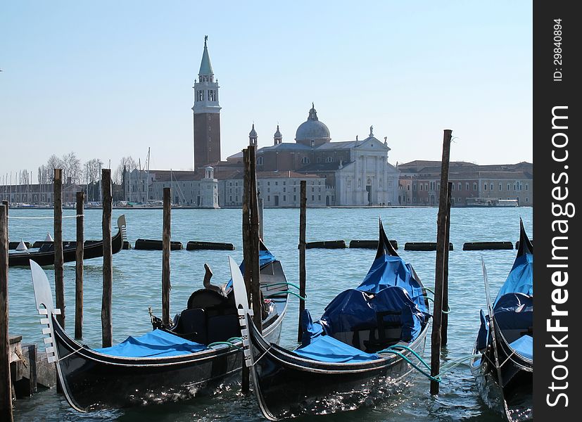 Gondolas in Venice and isle of San Giorgio Maggiore view from St Mark's Square. Gondolas in Venice and isle of San Giorgio Maggiore view from St Mark's Square