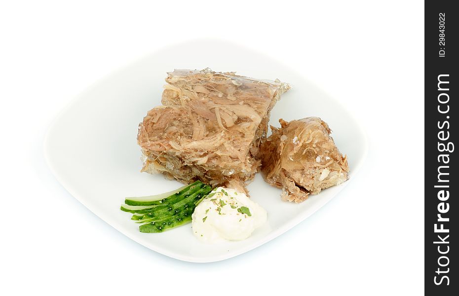 Beef Aspic with Horseradish and Cucumber on White Plate isolated on white background. Beef Aspic with Horseradish and Cucumber on White Plate isolated on white background