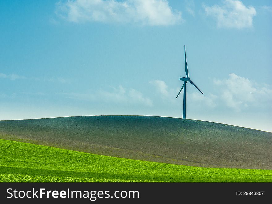 A windmill in the countryside horizon. A windmill in the countryside horizon