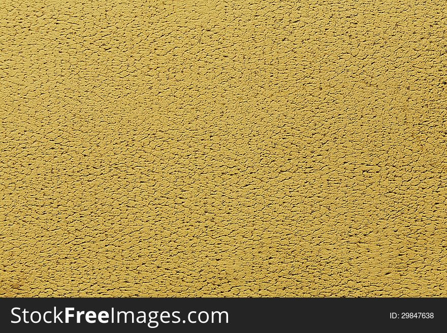 New yellow decorative cement plaster wall background. New yellow decorative cement plaster wall background