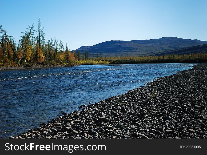 The river and its surroundings at the end of the summer. The Putorana Plateau, Russia, Taimyr Peninsula. The river and its surroundings at the end of the summer. The Putorana Plateau, Russia, Taimyr Peninsula.