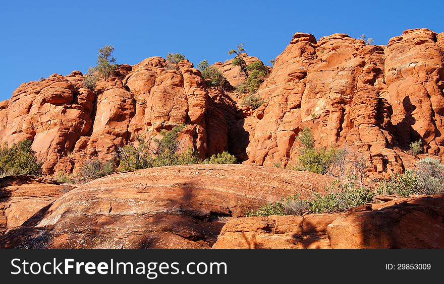Arizona red rock mountain scenery with bright blue sky.
