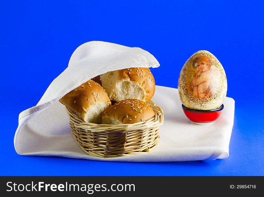 Buns in a basket and an Easter egg