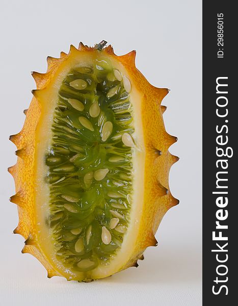 Kiwano or African horned melon over white background. Also known as hedged gourd, African Horned Cucumber, English tomato. Kiwano or African horned melon over white background. Also known as hedged gourd, African Horned Cucumber, English tomato.