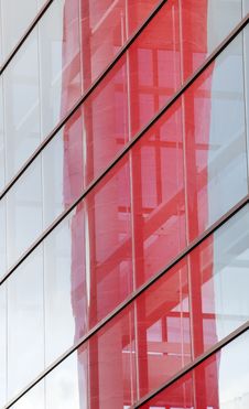 Contemporary Building With Blue Windows And Red Reflection Royalty Free Stock Image
