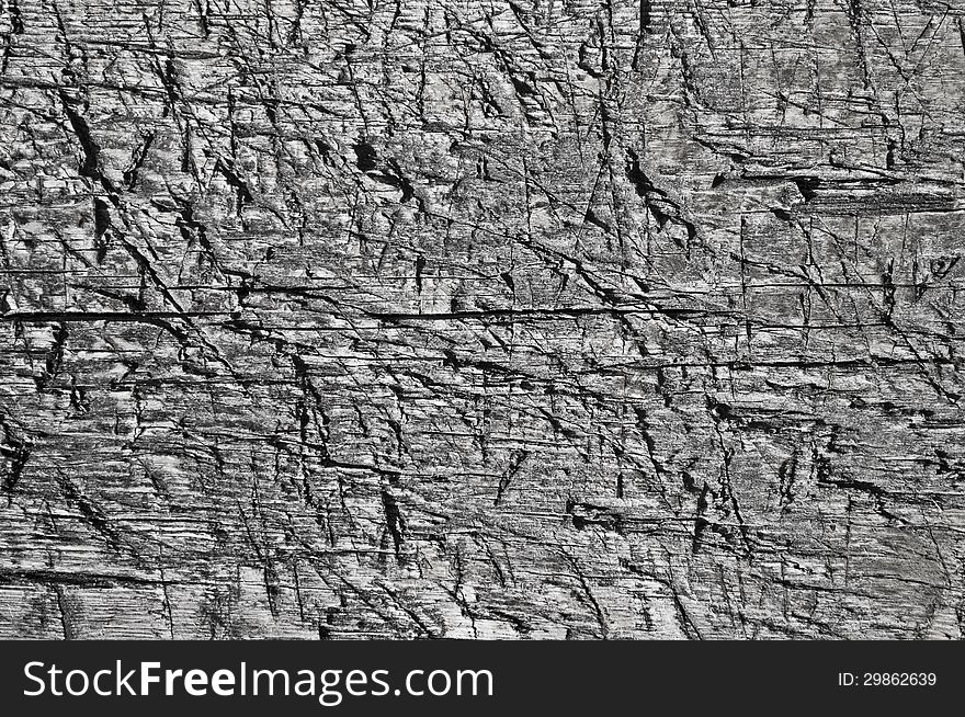 Fragment of old weathered rugged boards texture. Fragment of old weathered rugged boards texture