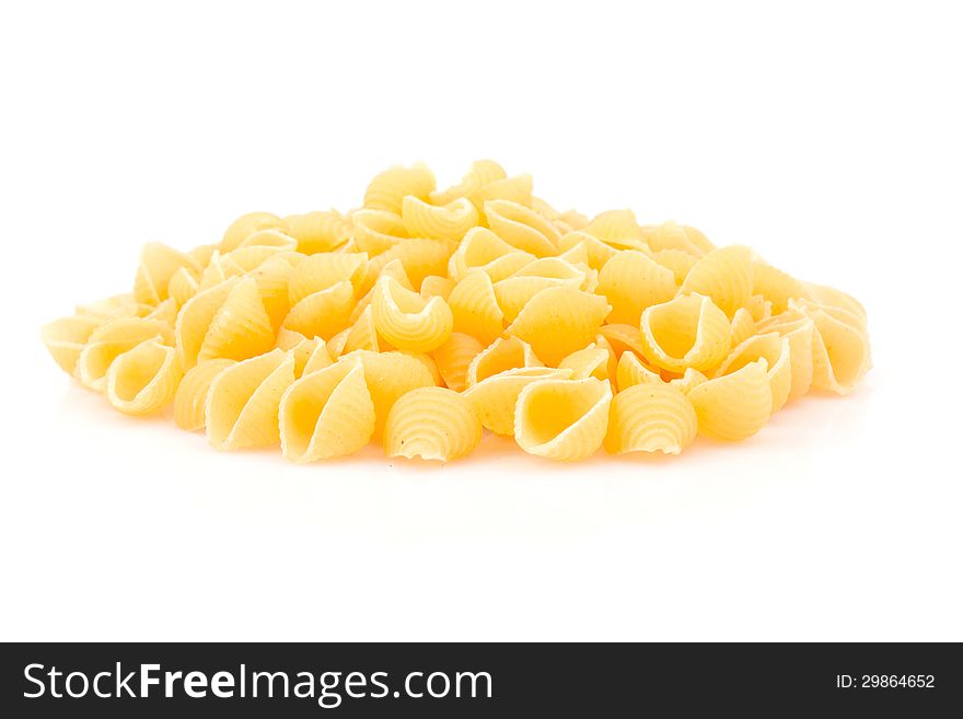 Italian pasta shell on white background, food ingredients