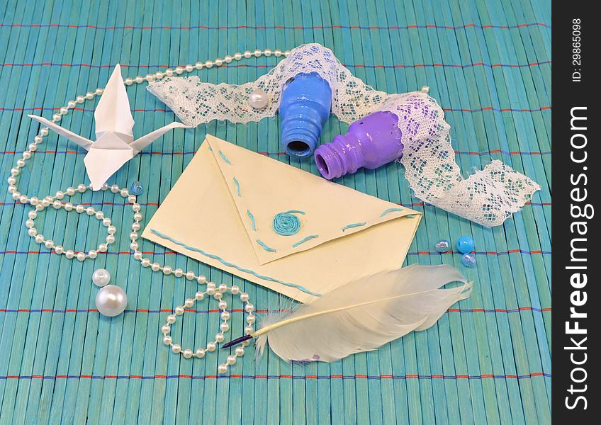 Paper envelope with bottles and origami bird. Paper envelope with bottles and origami bird