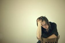 Portrait Of The Thoughtful Guy Sitting On A Chair Royalty Free Stock Photos Portrait Of The Thoughtful Guy Sitting On A Chair Royalty Free Stock Photos