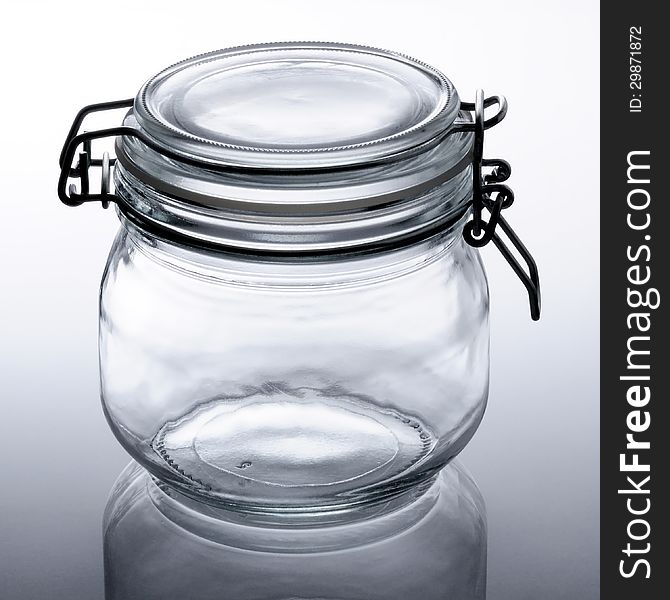 Closeup of an empty glass jar.