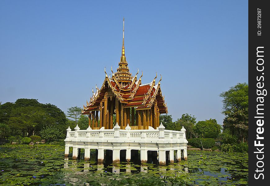 Pavilion at central of lotus pond in sunny day. Pavilion at central of lotus pond in sunny day