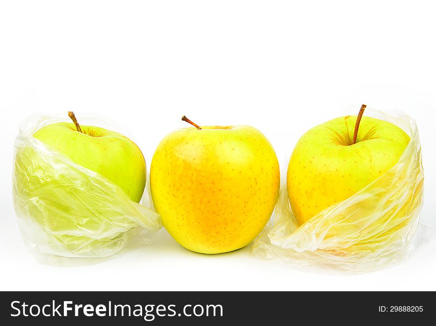 Three unpeeled apples on a white background