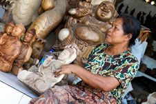 A Woman Is Polishing Wooden Buddha Royalty Free Stock Photos A Woman Is Polishing Wooden Buddha Royalty Free Stock Photos