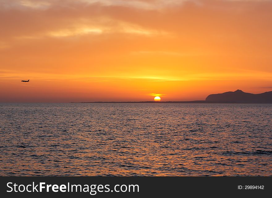 Sunset island sea sky fly orange seascape. Sunset island sea sky fly orange seascape