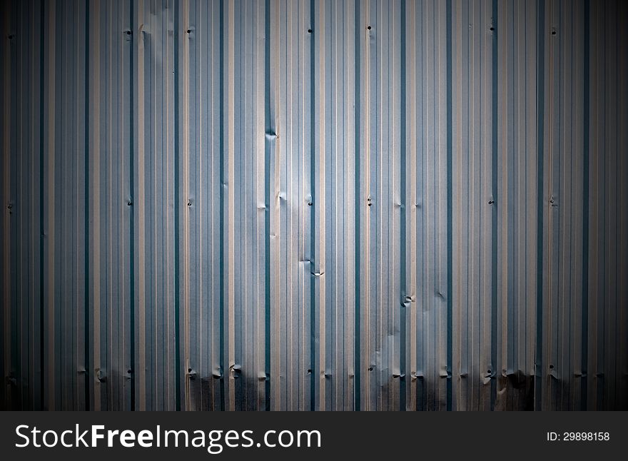 Corrugated metal rumpled sheet background texture. Corrugated metal rumpled sheet background texture